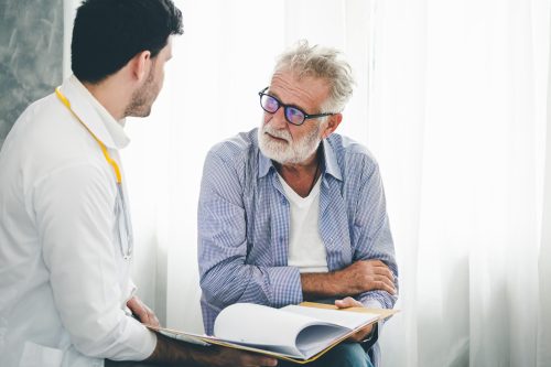 Professional psychologist doctor discussing with patient in therapy sessions at hospital room, Medical and Behavioral Health concept