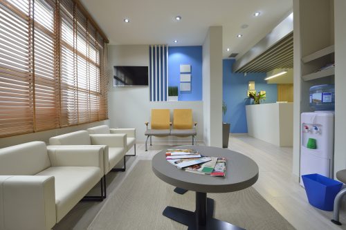 Interior of a modern waiting room. Clinical with empty chairs